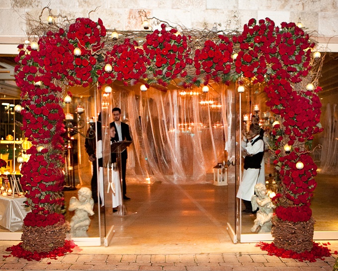 Red roses wedding arch