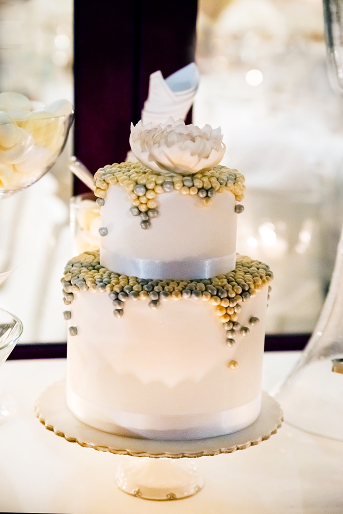 White wedding cake with gold and silver details