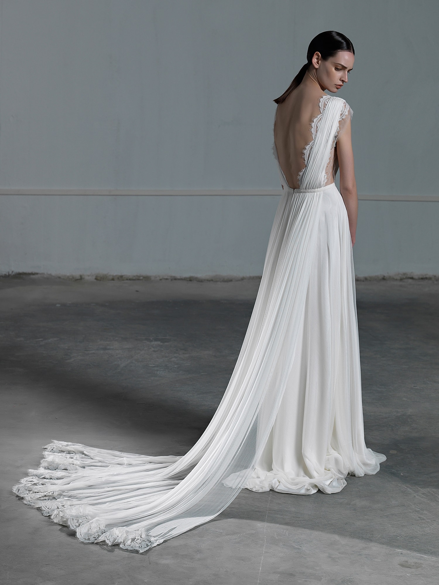 Romantic A line wedding dress with ethereal tulle skirt and lace top with low open back Vasia Tzotzopoulou