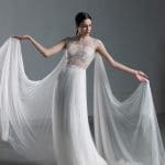 Impressive romantic A line wedding dress with illusion lace bustier and tulle cape