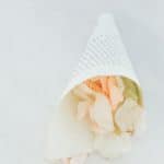 Paper wedding cone with rose petals