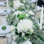 table runner with greenery and roses