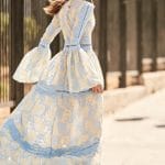 Long bell sleeved white dress with baby blue laced details Christos Costarellos