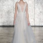 Ethereal wedding dress with bows on the shoulders and open low neckline Inbal Dror