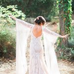 Trumpet laced wedding dress with long sleeves and open back